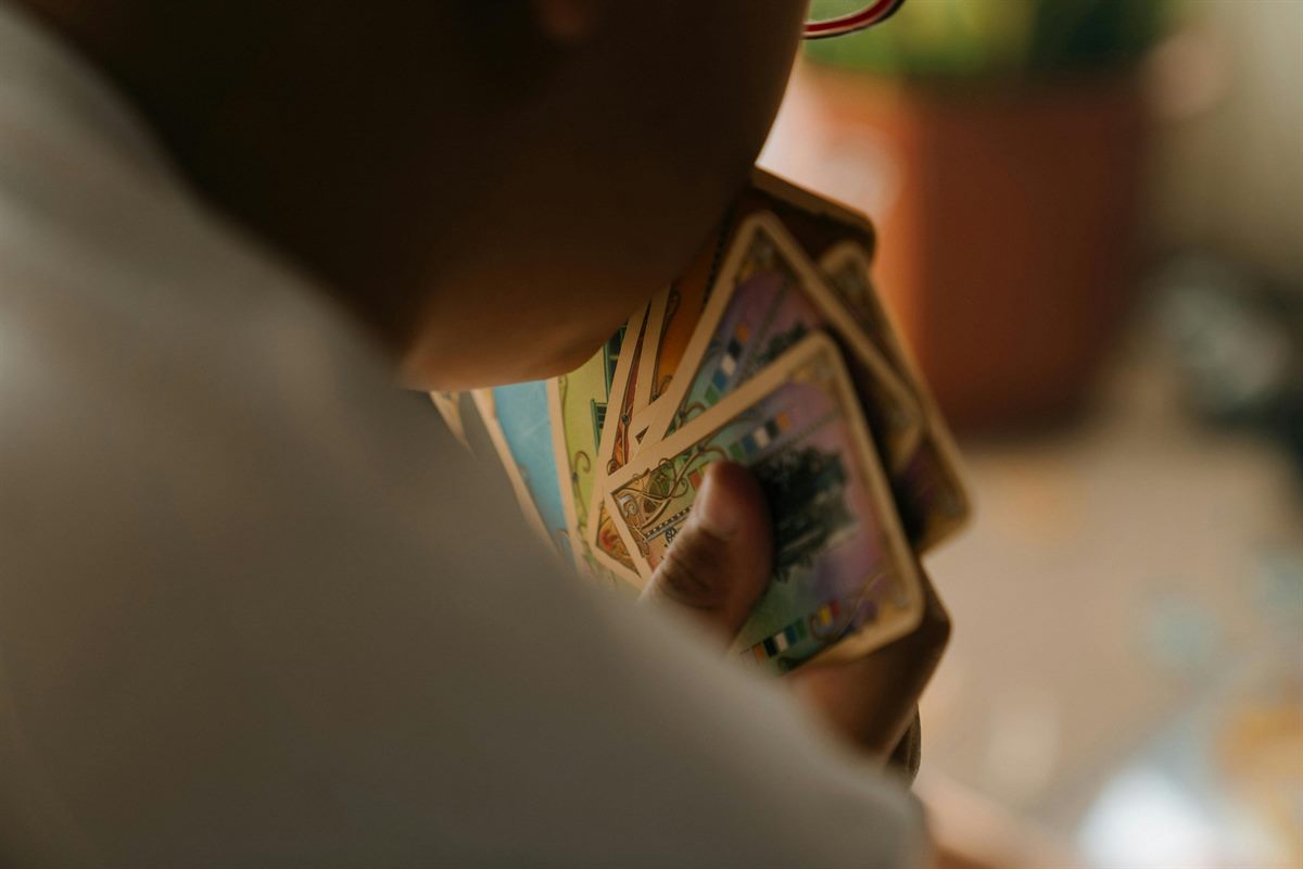 Kid grinning ear to ear opening a hand-picked trading card surprise